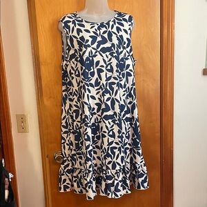 Sleeveless White Mini Dress with Navy Leaf Print and Ruffle Hem